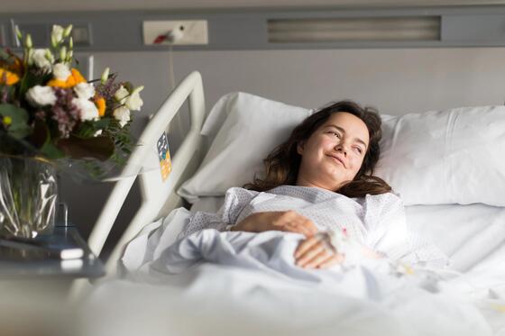Patient receiving flowers in hospital