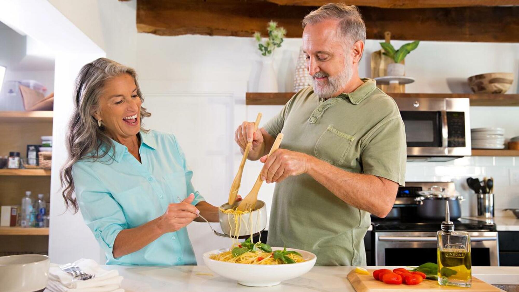 Man and woman cooking together